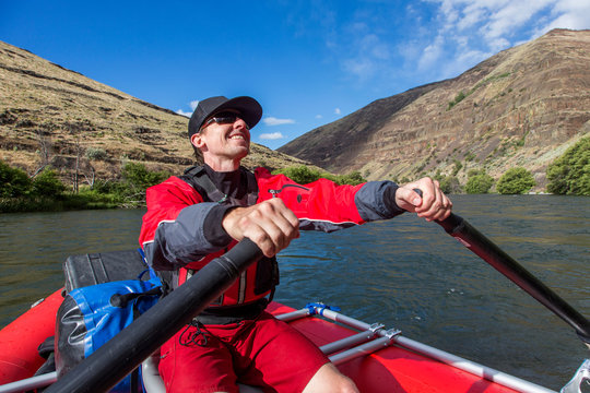 Man rowing on raft down Deschutes River