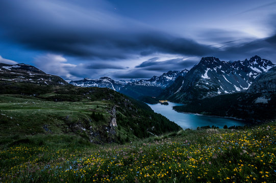 View of Devero Lake with the Lepontine Alps in background at dusk, after an heavy rain storm. Devero, Ossola, Italy.