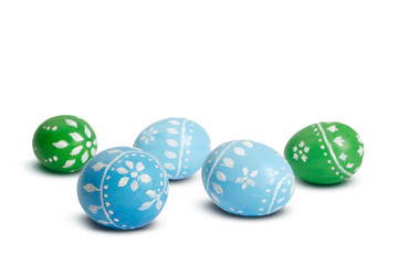 Blue and green easter eggs isolated on white background