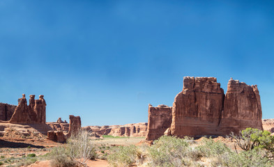 Extreme spires rise out of the landscape in Utah desert.