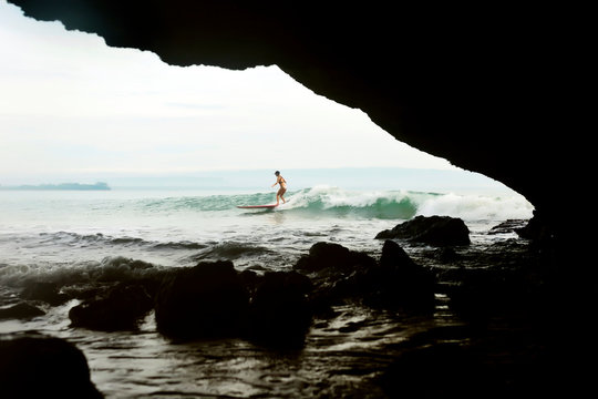 Female surfer on wave