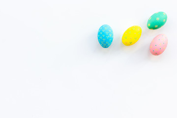 Easter celebration with colorful eggs on white background top view mock up