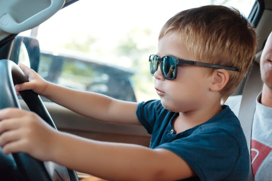 Little boy driving car