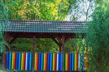 Beautiful gazebo bridge over the creek in the form of colored pencils