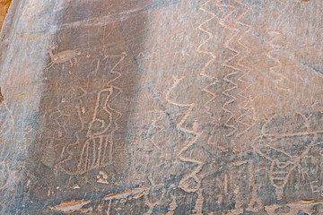 Rock Art scenes carved by the ancients on boulders in Utah.