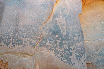 Rock Art scenes carved by the ancients on boulders in Utah.