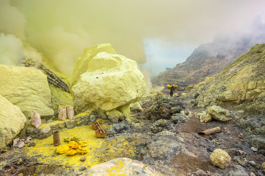 Worker carrying baskets of sulfur at Ijen volcano, Java