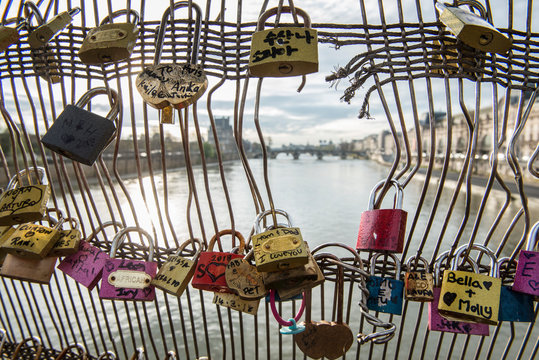 Love padlocks on bridge over Seine River, Paris, France