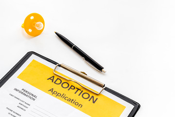 Application to adopt child with dummy on white background