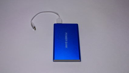 Power bank for charge telephone on white background-image