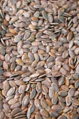 Heap of raw pumpkin seeds texture. Food background