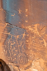 Rock Art scenes carved by the ancients on boulders in Utah.