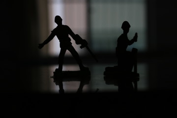 silhouette of soldier in combat position