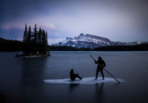 People on ice floe on Two Jack Lake at night, Canada