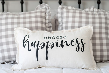 Choose happiness pillow on iron bed 