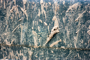 Close-up of the part of the car body in off-road dirt. The growth of clay on the car body. Large dirt stains