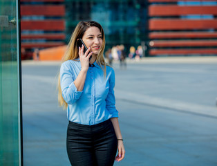 Beautiful businesswoman with mobilephone