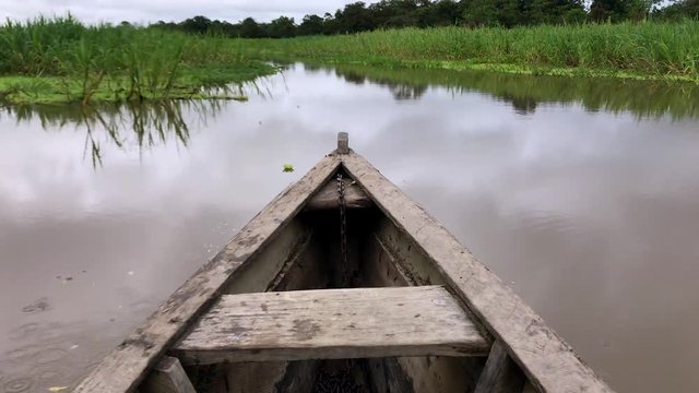 Amazon river - a wooden boat stem moving through water