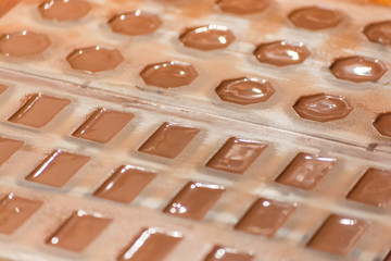 Part of the process of making homemade artisan chocolate sweets with different fillings for a special ocassion: valentine's day, a birthday or anniversary gift or the perfect souvenir