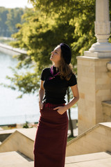 The girl in beret and skirt in the park	
