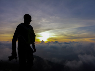 Obraz premium rremthe photographer stand alone on the top of mountain