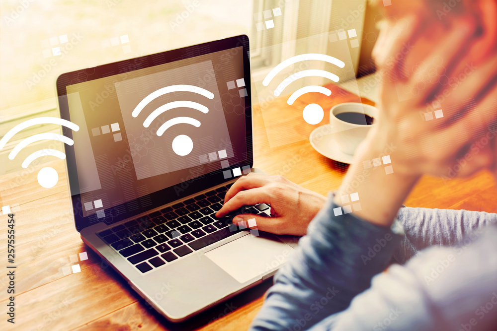 Poster wifi concept with man using a laptop computer