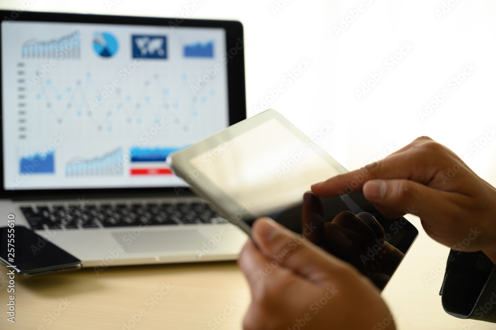 Poster man hands multitasking man using tablet close up close up working in office