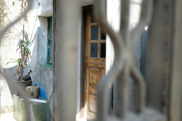 artistic shot of an old wooden door in macau