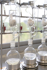 Soxhlet Extractor.Percolator-boiler and reflux,distillation flask on heating element.
