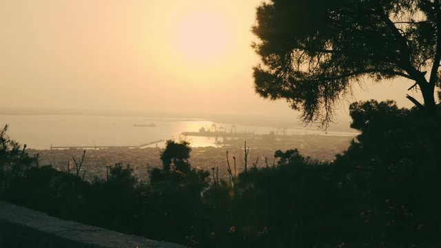 Thessaloniki / Greece 22 march 2019 : sunset in the most beautiful city of Greece photo taken from the hilltop forest Kedrinos Lofos, also known as Seich Sou,the temperture is fine for a walk