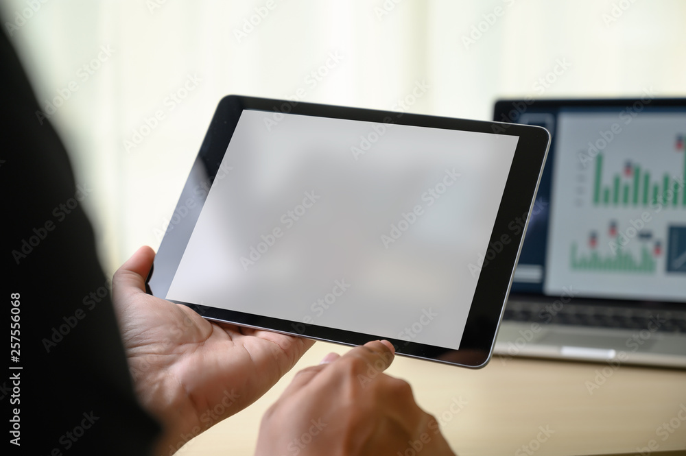 Poster man hands multitasking man using tablet close up close up working in office