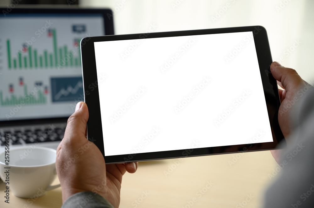 Poster man hands multitasking man using tablet close up close up working in office
