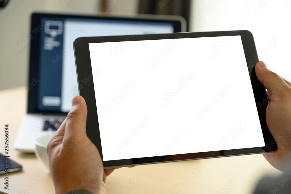 Poster man hands multitasking man using tablet close up close up working in office