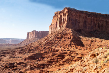Fototapeta premium Monument Valley famous rock formations under a blue sky.