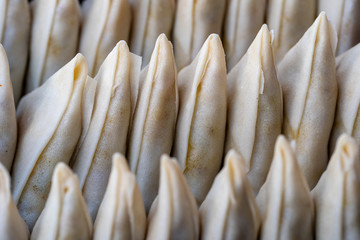 Potato samosa for sell at street food market in island Koh Phangan, Thailand , closeup