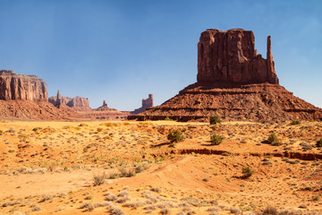 Fototapeta na wymiar Monument Valley famous rock formations under a blue sky.