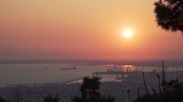 Thessaloniki / Greece 22 march 2019 : sunset zoom in in the most beautiful city of Greece photo taken from the hilltop forest Kedrinos Lofos, also known as Seich Sou,the temperture is fine for a walk