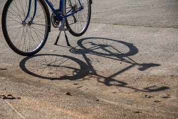 Fototapeta na wymiar Shadow of the bike on the road
