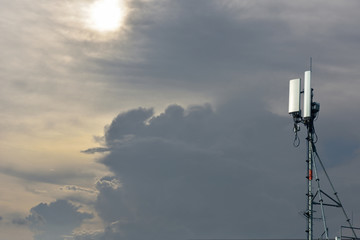 Smart phone and cellular phone pole in the sun set atmosphere.