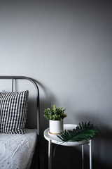  Bedroom Corner with artificial plants in white ceramic marble pattern paint on white metal side table in modern scandinavian style / modern minimal / cozy interior design concept