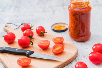 A plate of ketchup and tomatoes