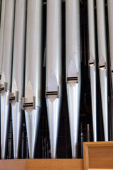 A closeup of organ pipes.