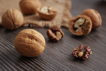 walnuts on dark wooden table selective focus