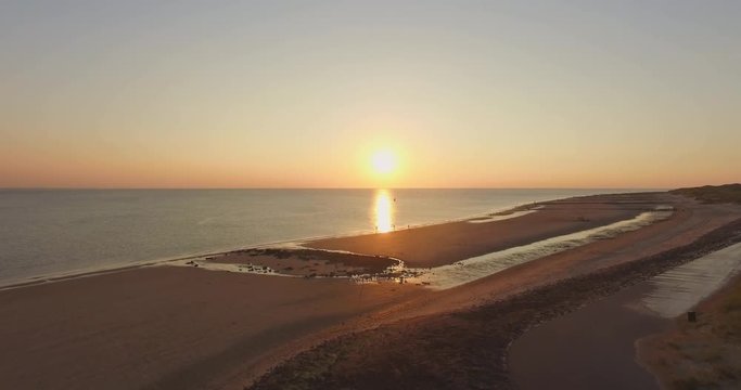 Aerial: The beach between Vlissingen and Dishoek during sunset.