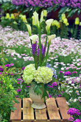 Flower in vase on wooden box show at flora exhibition, beautiful flowery pattern, garden decorative, art of bouquet design, flower bouquet design, flower bouquet style, flowery garden, flowering plant