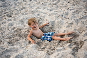 Fototapeta na wymiar Young boy enjoying the beach