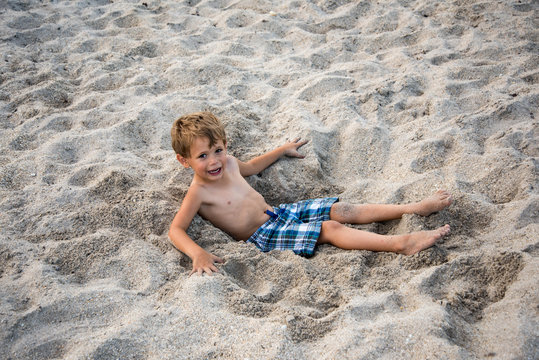 Young boy enjoying the beach