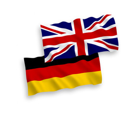 National vector fabric wave flags of Great Britain and Germany isolated on white background. 1 to 2 proportion.