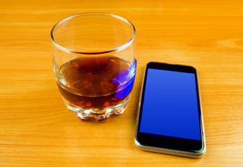 Fototapeta na wymiar Phone and a Whiskey