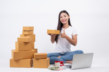 Fototapeta na wymiar Happy women from ordering products from customers, business owners who work at home on a white background, Online shopping business operators Independent work concept.